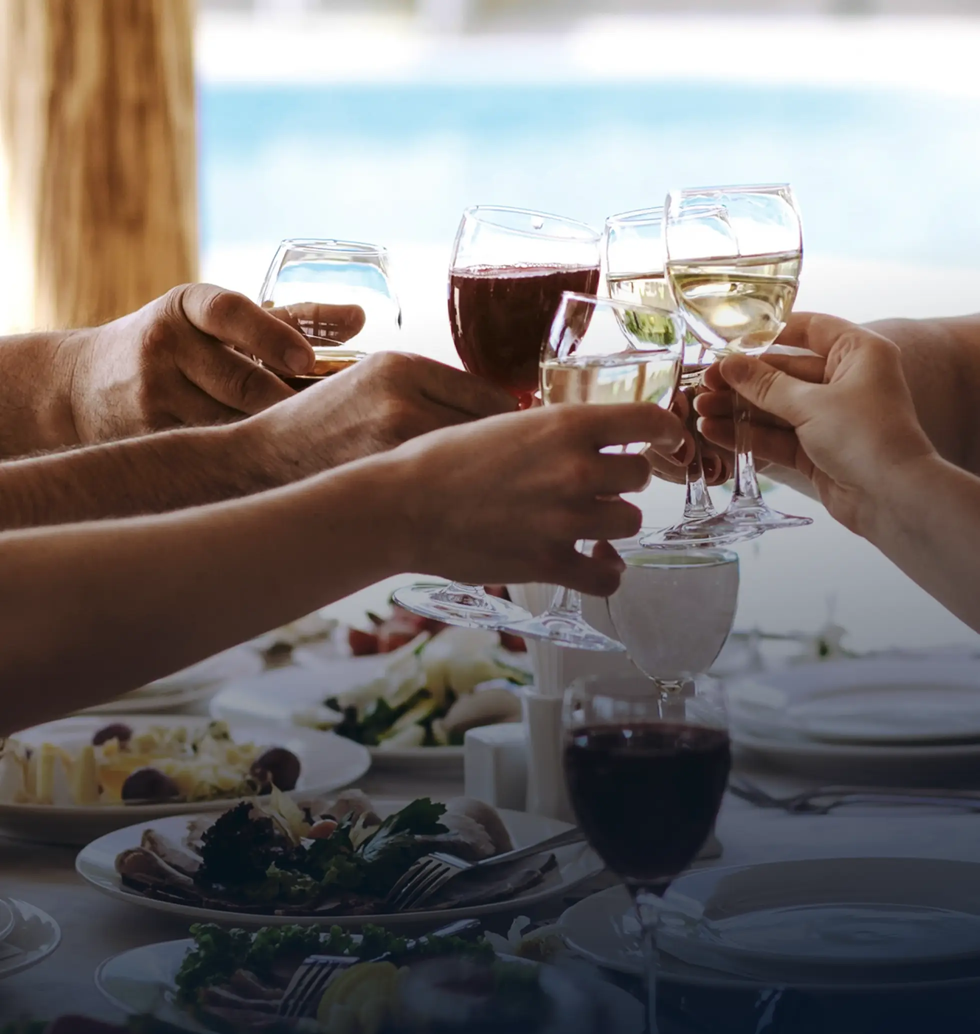 Guests toasting with wine aboard a July 4th yacht charter in Miami