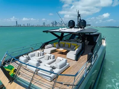 Private yacht aft deck set for a romantic Miami sunset charter with the downtown skyline behind